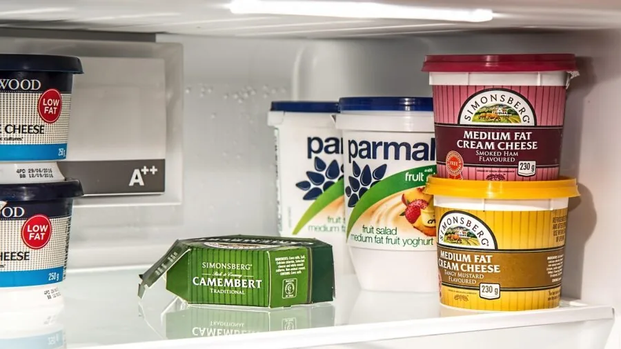 Well-organized refrigerator interior with neatly arranged food items and containers showing efficient storage solutions