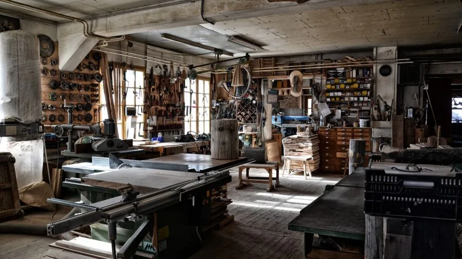 Well-organized workshop with neatly arranged tools and storage solutions on wooden workbench