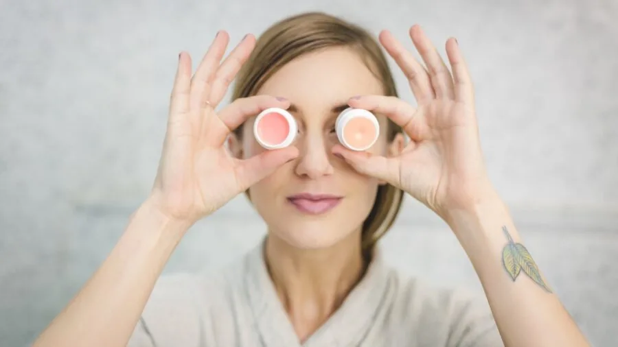 Woman applying hydrating lip balm with natural ingredients for comfortable lip care routine