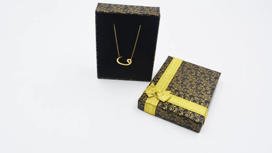 Woman carefully closing and latching a jewelry box for secure storage and transport