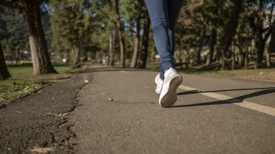 Woman doing outdoor workout in athletic wear, active lifestyle fitness scene