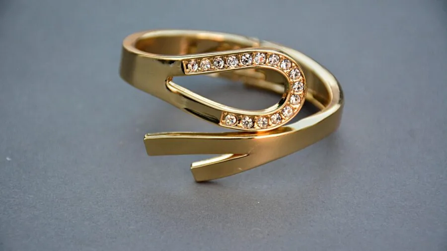 Woman examining and comparing different jewelry pieces to evaluate value and quality across price points