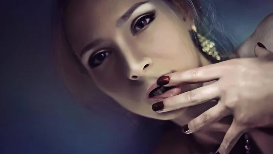 Woman gently buffing her natural nails with proper technique and care