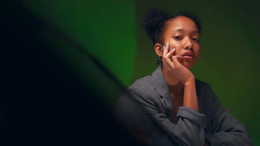Woman in blazer transitioning between work and casual settings, demonstrating versatile styling options