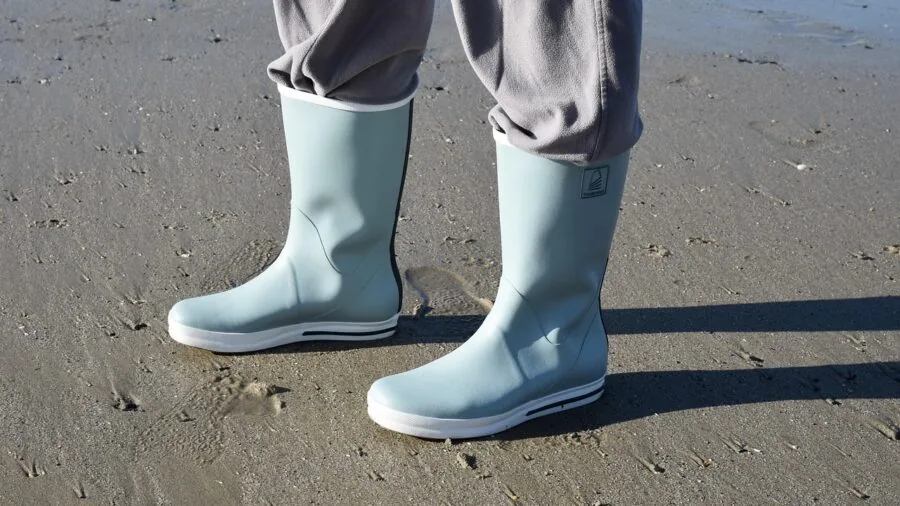 Woman in casual footwear strolling through a sunny outdoor path, demonstrating comfortable all-day walking