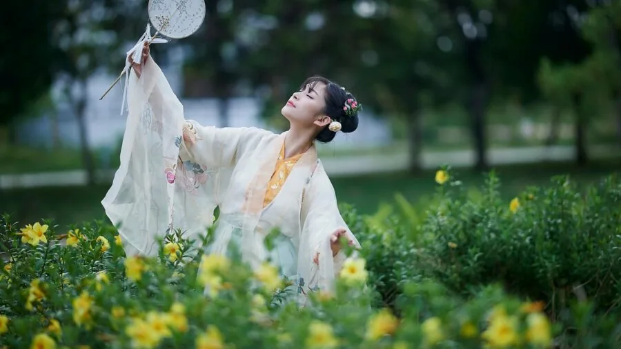 Woman in flowing fabric dress enjoying outdoor comfort and movement