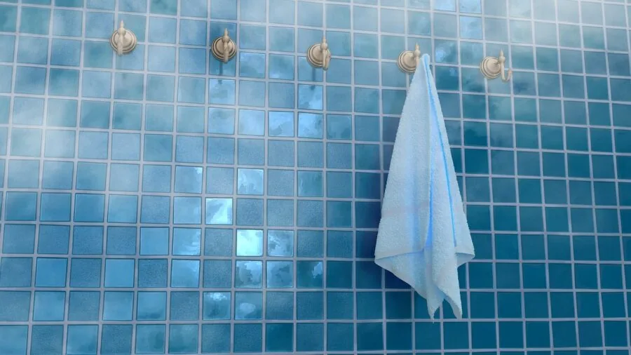 Woman in shower demonstrating water-resistant personal grooming routine in modern bathroom