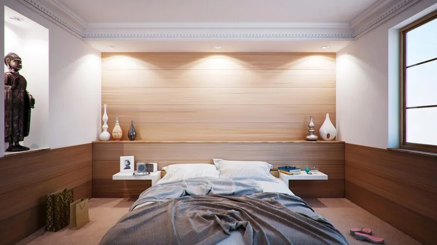 Woman peacefully sleeping on a comfortable mattress in a bright bedroom with natural morning light