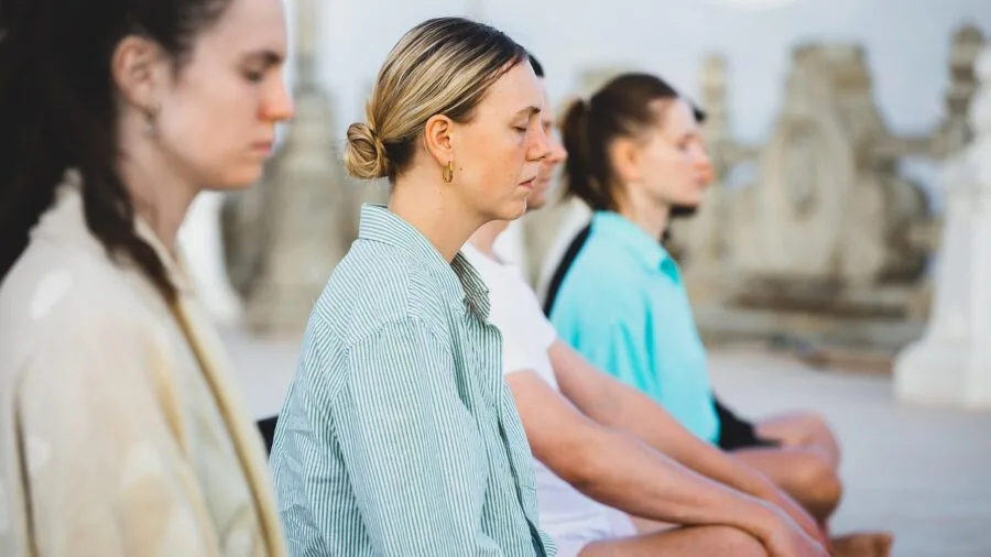 Woman performing forward fold in yoga practice, demonstrating flexibility and proper form