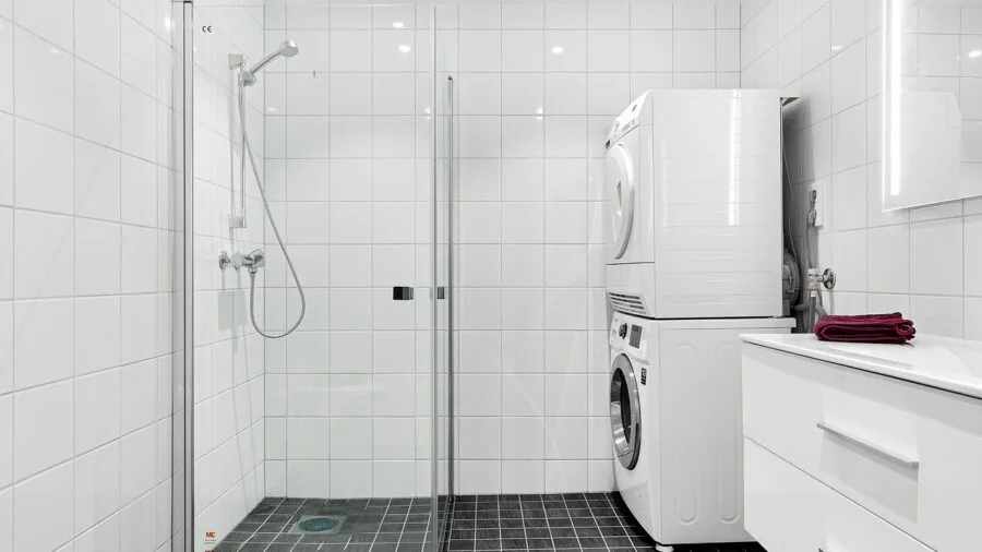 Woman rinsing hair in shower during daily hair care routine