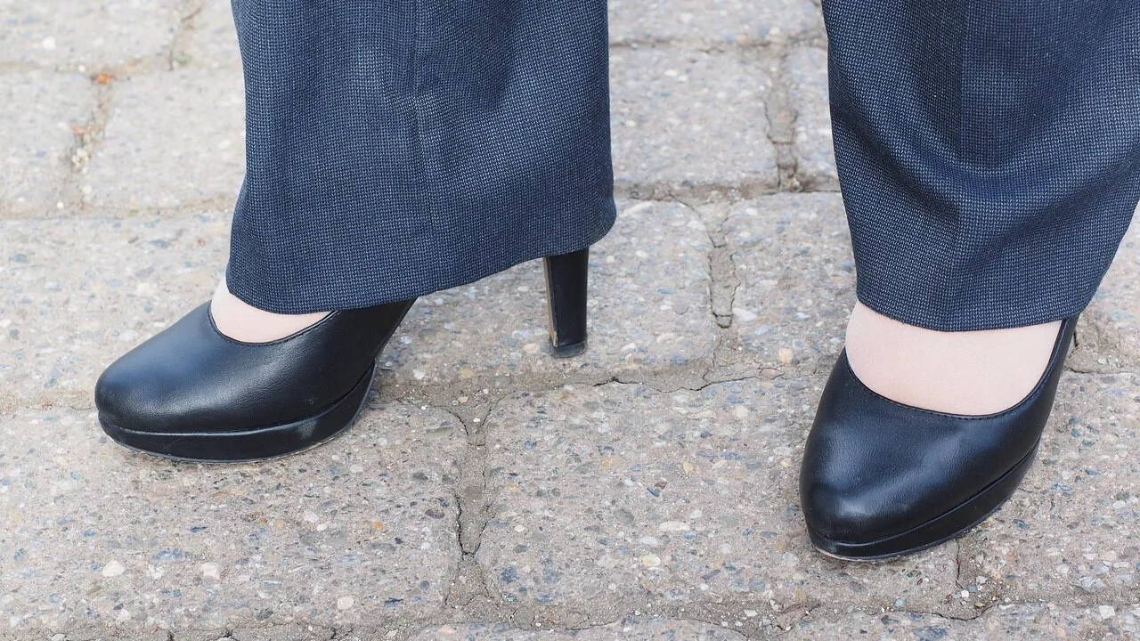 Woman wearing comfortable flat shoes, showing various styles in neutral setting