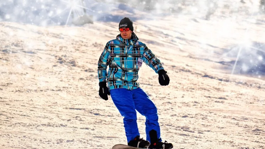 Woman wearing layered clothing during outdoor winter activity in natural landscape