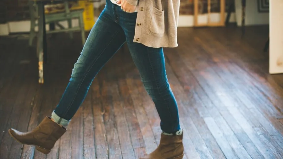 Woman wearing neutral cardigan over casual outfit in everyday lifestyle setting