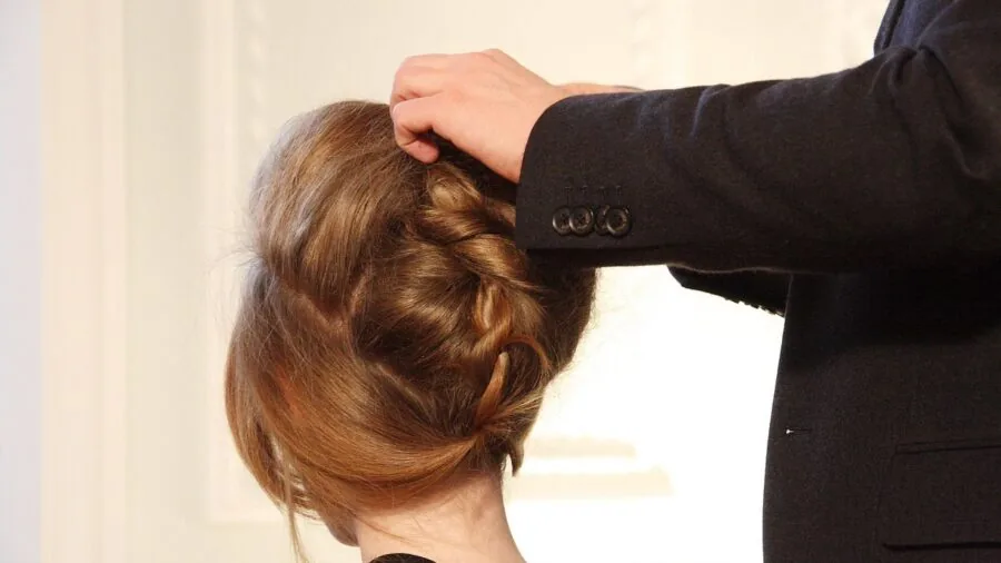 Woman with fine hair styled with volume at the roots, demonstrating lightweight hair styling technique