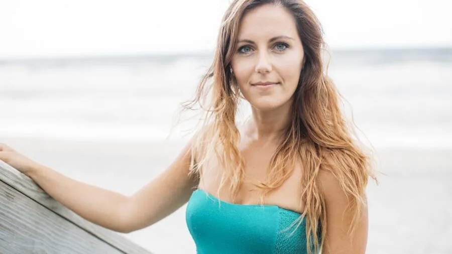 Woman with natural textured hair enjoying outdoor lifestyle with soft, touchable waves