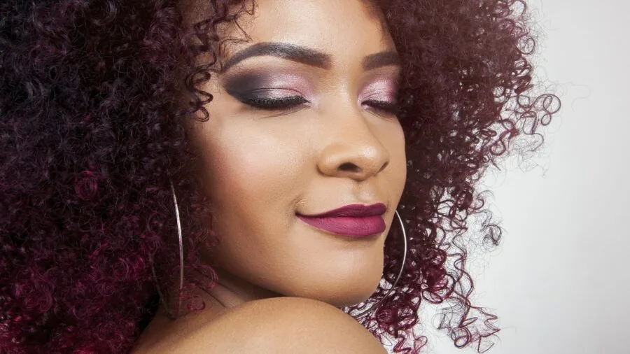 Woman with thick curly hair texture showing natural hair styling and texture detail
