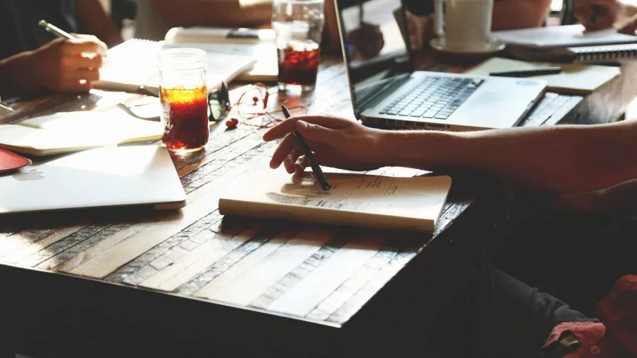Woman working at desk in quiet office environment, focused and peaceful atmosphere
