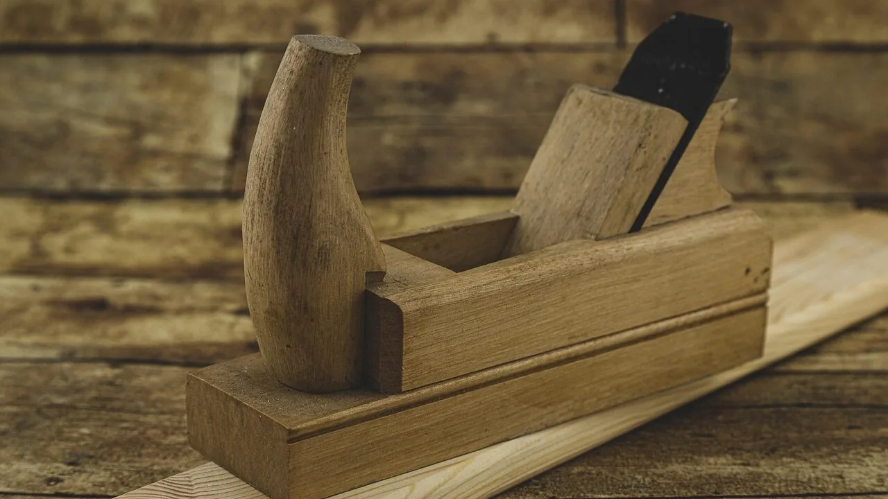 Wooden workbench with tools and storage in garage workshop setting