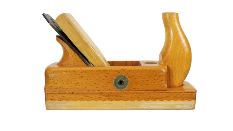 Woodworker performing angled bevel cuts on wooden trim piece during carpentry project