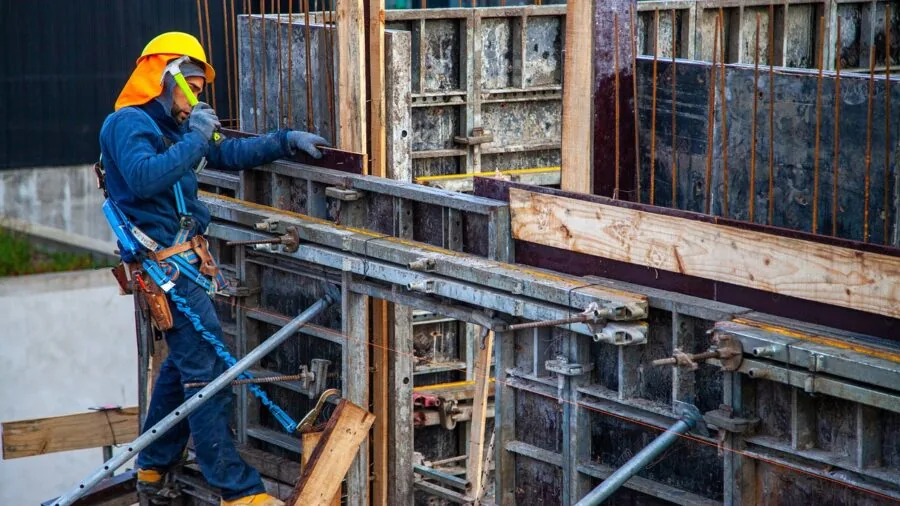 Worker evaluating different tool options for budget-conscious purchase decision