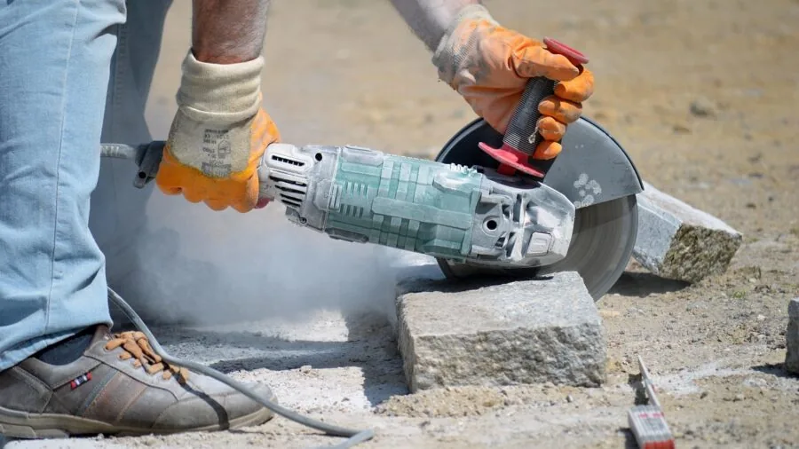 Worn utility tools and equipment in a construction work environment showing real wear and durability