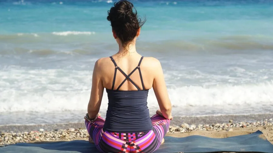 Worn yoga mat showing signs of travel use and frequent practice, demonstrating durability testing