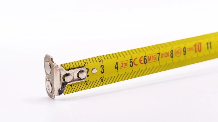 Young child being measured for proper size fit during growth and development stages