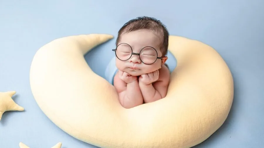 Young child peacefully sleeping on comfortable bedding with soft fabric textures
