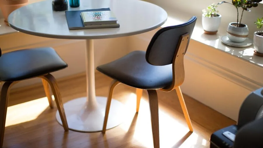 Young child playing safely on floor near furniture corner in home environment
