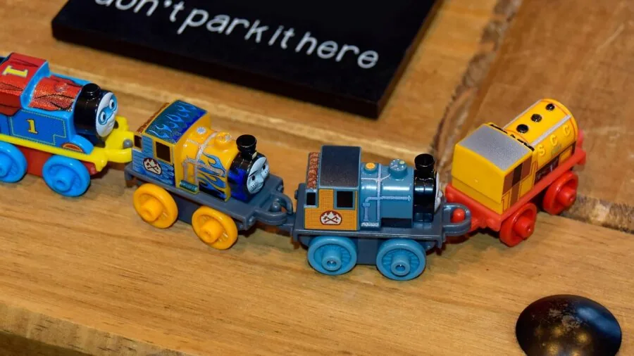 Young toddler safely playing with age-appropriate kitchen toys on a low play set