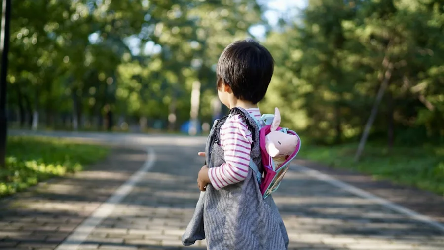 Young toddler wearing a properly fitted backpack while exploring outdoors